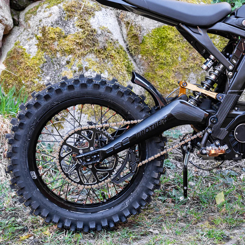 IZI Brothers black aluminum swingarm installed on Sur-Ron Light Bee electric motorcycle outdoors